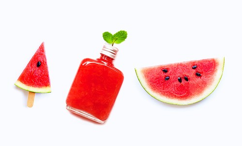 Watermelon slice and popsicle with  bottle of healthy watermelon juice isolated on white.