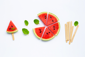 Slices of watermelon with popsicle on white background. Top view