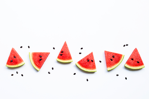 Slices of watermelon with seeds isolated on white, top view