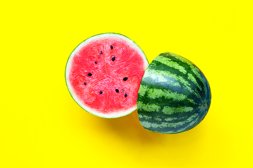 Fresh watermelon on yellow background. Top view