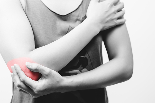closeup women elbow pain/injury with red highlights on pain area with white backgrounds, healthcare and medical concept - B&W filter