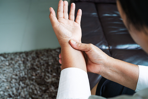 old woman suffering from wrist hand pain, health problem concept