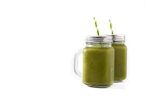 Healthy green smoothie with spinach,mint, kiwi, ginger and green apple isolated on white