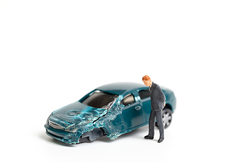 Miniature people : Accident scene, car crash on white background , Safety driving concept