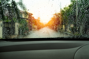poor vision rain drops on car glass in rainy days