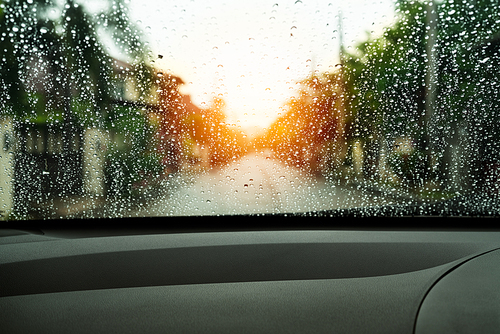 poor vision rain drops on car glass in rainy days