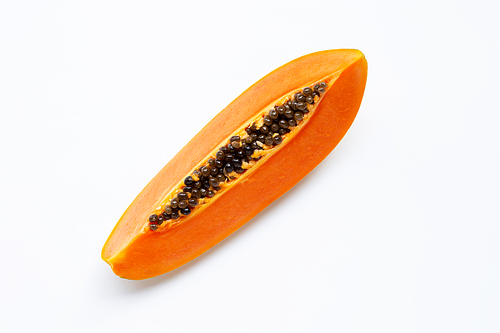 Cut ripe papaya fruit with seed on white background