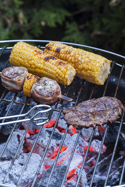meat and corn on the grill