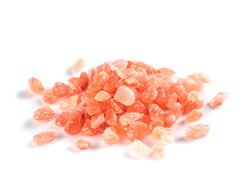 Himalayan pink salt in crystals on white background. Heap of pink salt isolated with clipping path.