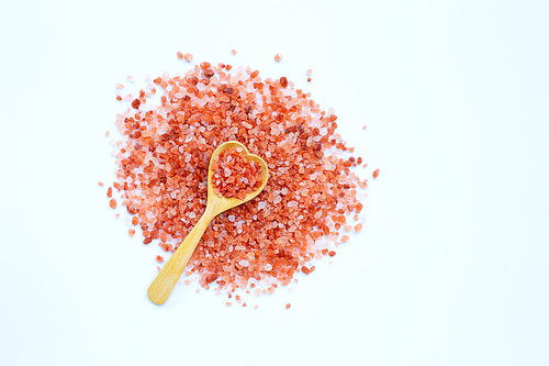 Pink himalayan salt on white background
