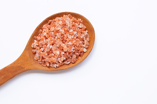 Pink himalayan salt on white background