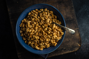 Breakfast concept with corn flakes in a bowl with copy space