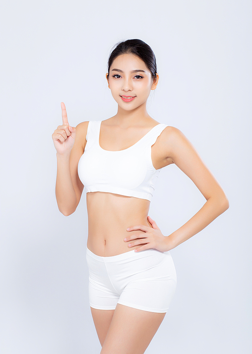 Portrait young asian woman smiling beautiful body diet with fit and finger pointing something isolated on white, model girl weight slim with cellulite or calories, health and wellness concept.