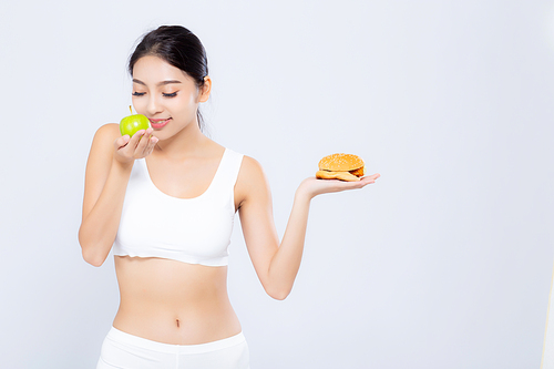 Beautiful young asian woman slim shape with diet choosing fresh salad vegetable and hamburger isolated on white, food healthy with control for weight loss with calories, nutrition and lifestyle concept.