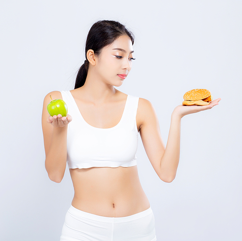 Beautiful young asian woman slim shape with diet choosing fresh salad vegetable and hamburger isolated on white, food healthy with control for weight loss with calories, nutrition and lifestyle concept.