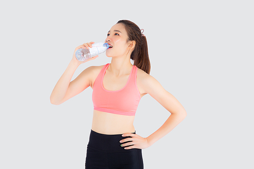 Beautiful young asian woman fit shape drinking water after workout and exercise isolated on white, girl thirsty after aerobic tired for refresh, model fitness healthy and wellness concept.