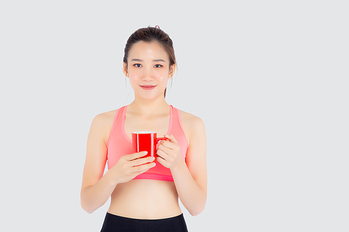 Beautiful young asian woman in sport after workout drinking water from glass for thirsty isolated on white, girl after exercise drink coffee or tea for hydration and refresh with healthy.