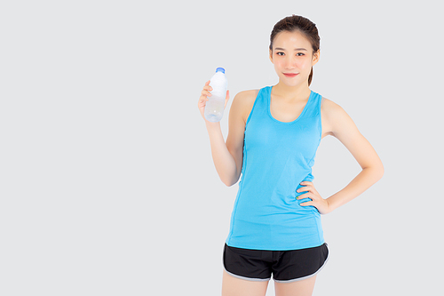 Beautiful young asian woman in sport after workout drinking water from bottle for thirsty isolated on white, asia girl after exercise drink water for hydration and refresh with healthy.