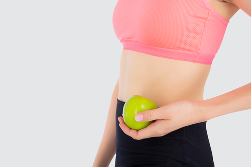 Closeup beautiful young asian woman in sport clothing satisfied and holding green apple isolated on white, girl asia have shape and wellness, exercise for fit with health concept.