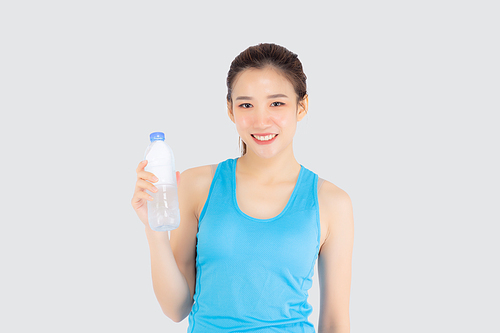 Beautiful young asian woman in sport after workout drinking water from bottle for thirsty isolated on white, asia girl after exercise drink water for hydration and refresh with healthy.