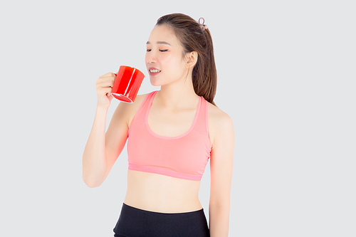 Beautiful young asian woman in sport after workout drinking water from glass for thirsty isolated on white, girl after exercise drink coffee or tea for hydration and refresh with healthy.
