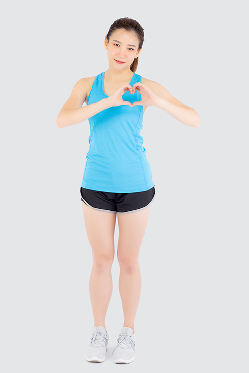Beautiful young asian woman in sport with healthy gesture heart shape with hand isolated on white, asia girl showing heart symbol, exercise with cardio for health and wellbeing concept.