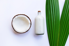 Coconut with coconut milk on white background