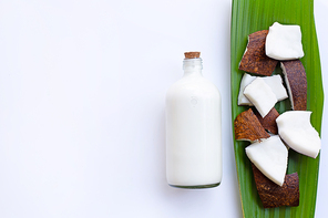 Coconut with coconut milk on white background.