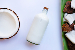 Coconut and coconut milk on white background.