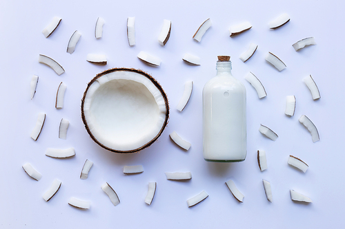 Coconut and coconut milk on white background.