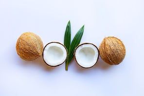 Coconut with green leave on white background.