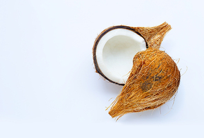 Ripe coconut on white background. Top view of tropical fruit. Copy space