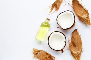 Coconut oil with coconuts on white background.