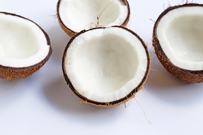 Ripe coconuts on white background. Top view of tropical fruit.