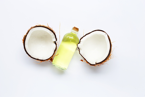 Coconut oil with coconuts on white background.