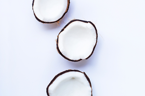 Ripe coconuts on white background. Top view of tropical fruit.