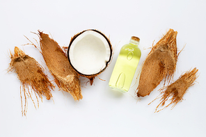 Coconut oil with coconuts on white background.