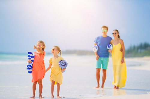 Young family on the beach. Summer vacation