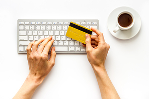 shopping online payment. Hand enter data on keyboard on desk top-down.