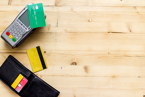 Payment by credit card. Terminal on background top-down.