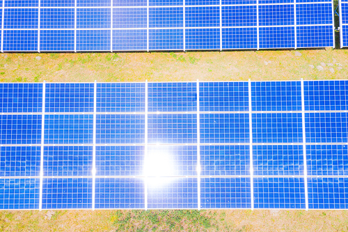 solar panels with the sunny sky. Blue solar panels. background of photovoltaic modules for renewable energy. Aerial view of Solar panels Photovoltaic systems industrial landscape