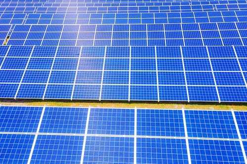 solar panels with the sunny sky. Blue solar panels. background of photovoltaic modules for renewable energy. Aerial view of Solar panels Photovoltaic systems industrial landscape