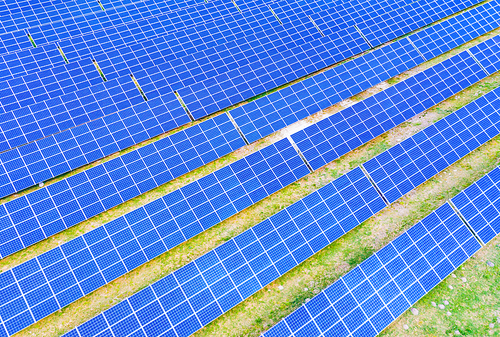 solar panels with the sunny sky. Blue solar panels. background of photovoltaic modules for renewable energy. Aerial view of Solar panels Photovoltaic systems industrial landscape