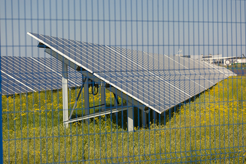 Grin clean electric power - Solar panel outside on grass photovoltaic