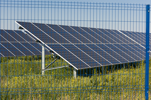 Grin clean electric power - Solar panel outside on grass photovoltaic