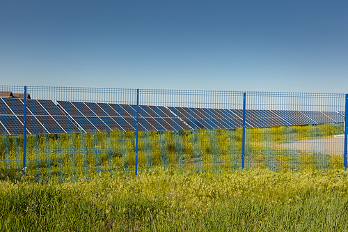 Grin clean electric power - Solar panel outside on grass photovoltaic