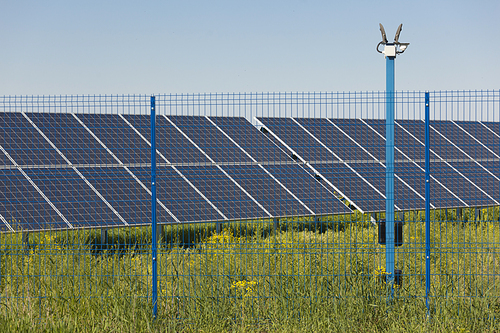 Grin clean electric power - Solar panel outside on grass photovoltaic