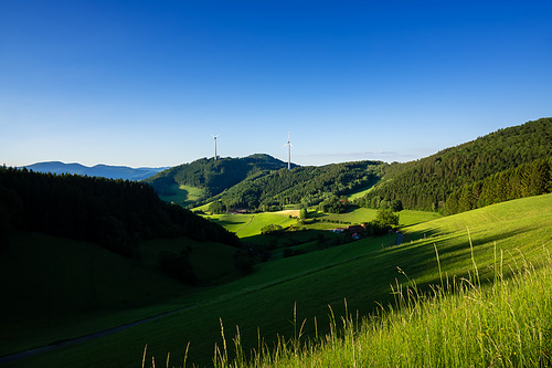 An image of a landscape with wind energy in the black forest area Germany