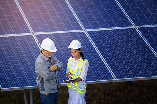 Engineers are checking the solar panel for maintenance. And clean the solar panel is always available.