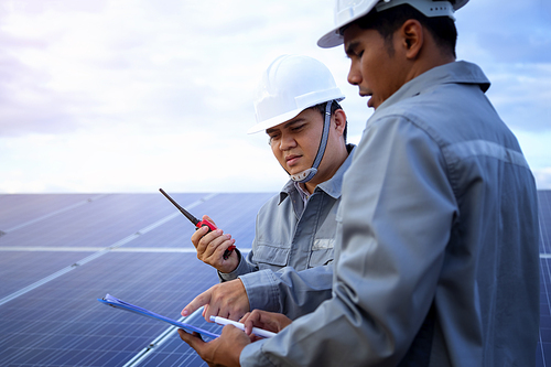 Engineers are checking the solar panel for maintenance. And clean the solar panel is always available.